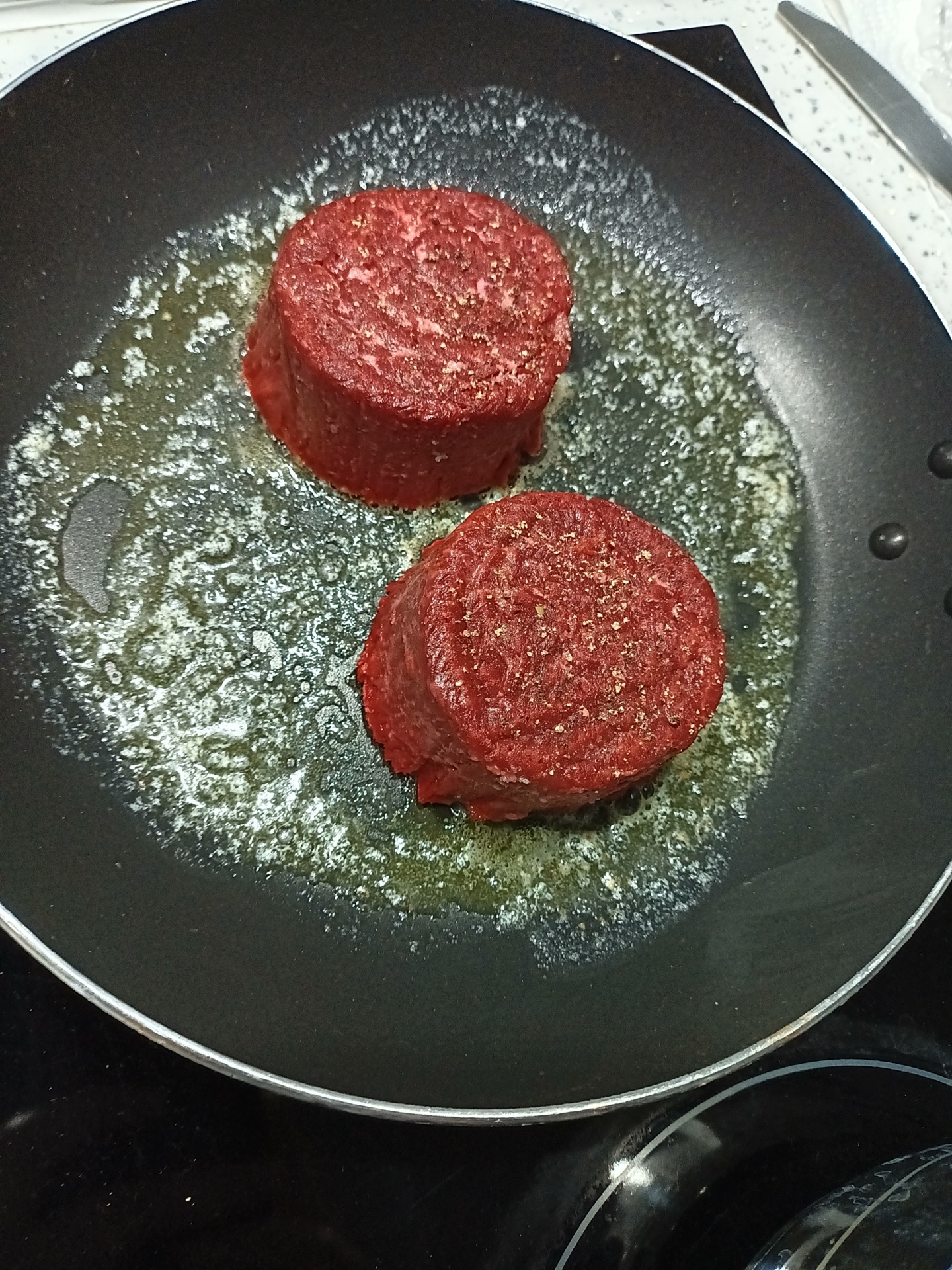 vegan steaks cooking in butter