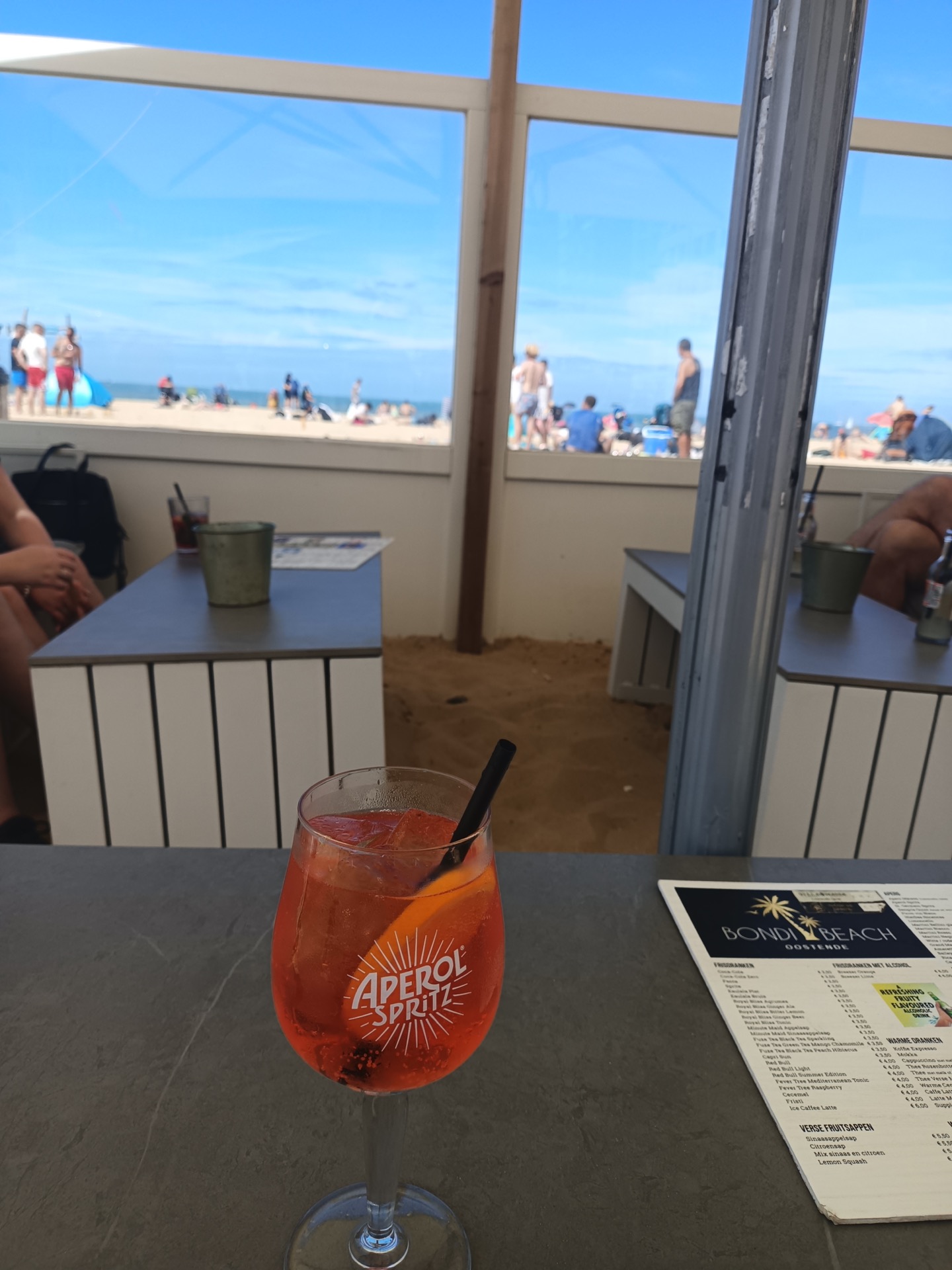 Aperol Spritz overlooking the ocean at Zeebrugge Beach